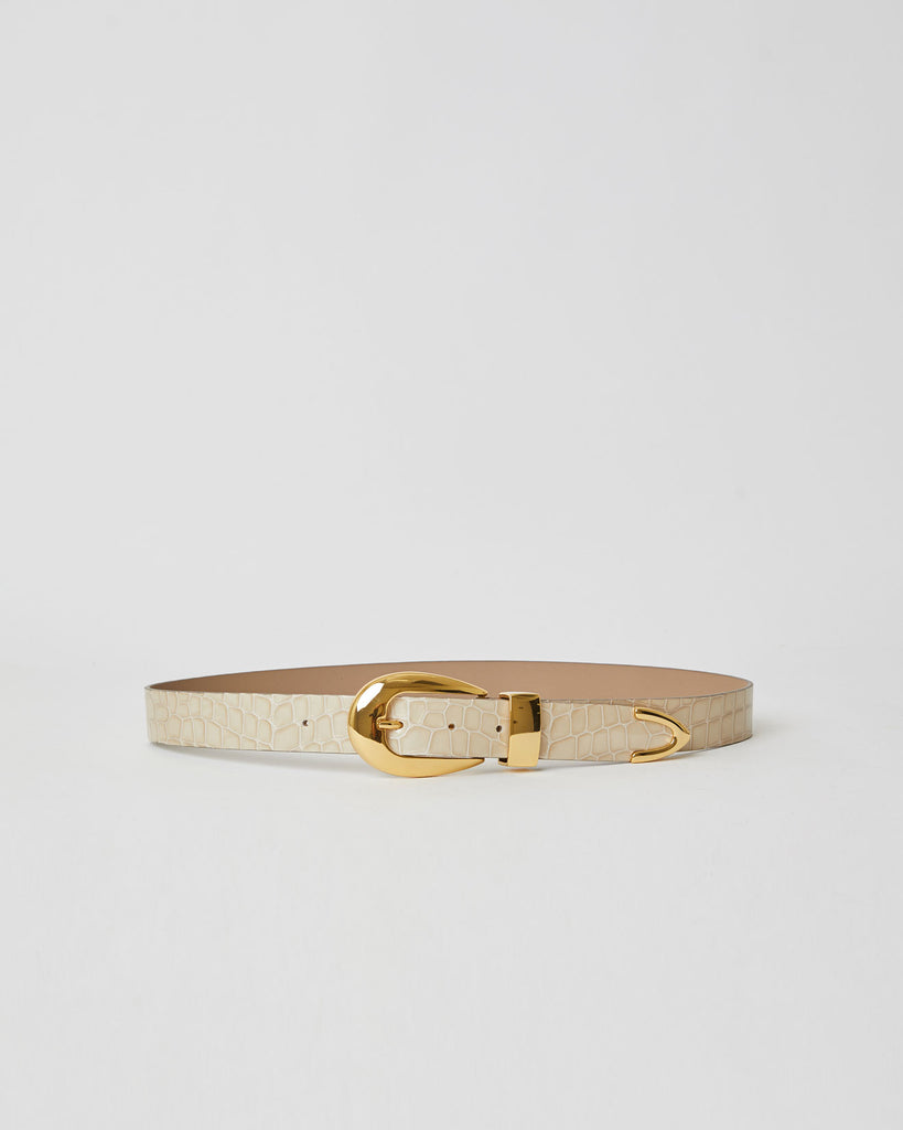 Light sand shiny leather belt with croc-embossed strap. Detailed with shiny gold rounded buckle, keeper, and tip accent.