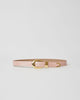 Light pink shiny leather belt with croc-embossed strap. Detailed with shiny gold rounded buckle, keeper, and tip accent.