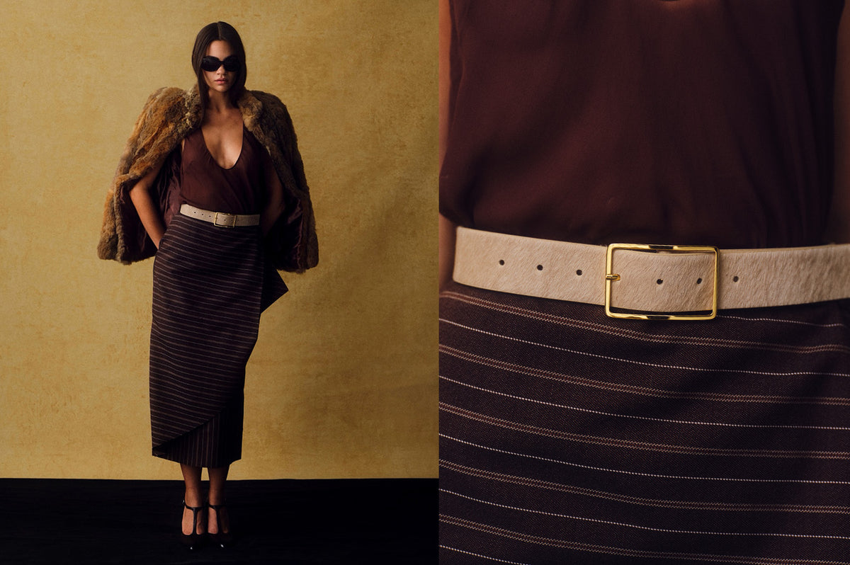 close up of a light sand colored calf-hair belt with a gold rectangular buckle next to a photo of a model wearing the belt with a for coat and burgundy striped skirt.