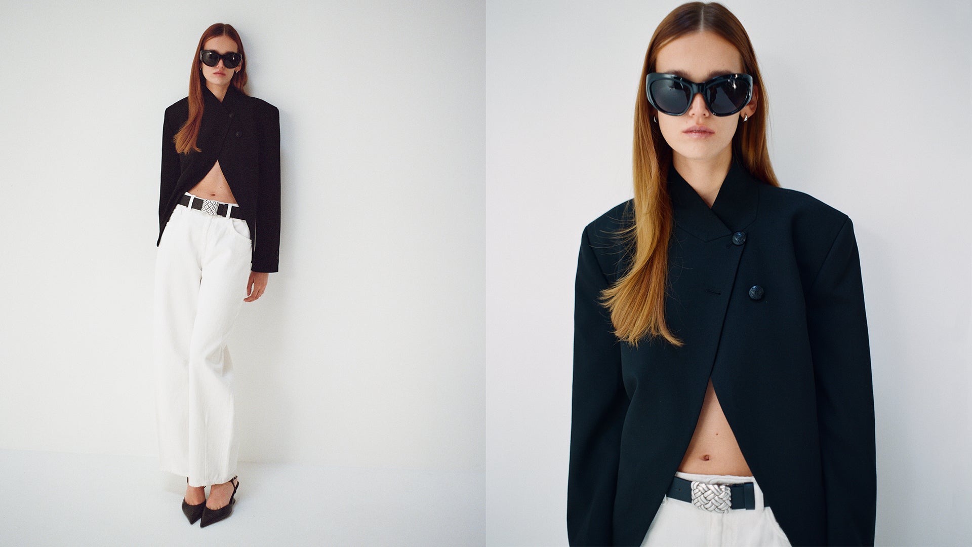 Two women wearing black blazers and white pants against a white background with black belt that has a big silver buckle