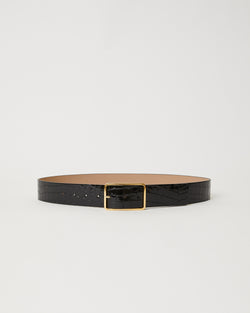 Black shiny leather belt with croc-embossed finish. Fastens with simple gold triangle shaped buckle.
