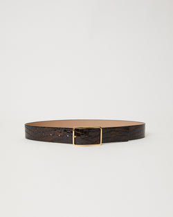 Bronze colored shiny leather belt with croc-embossed finish. Fastens with simple gold triangle shaped buckle.