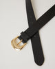 classic skinny black leather belt with a simple gold buckle and leather keeper.