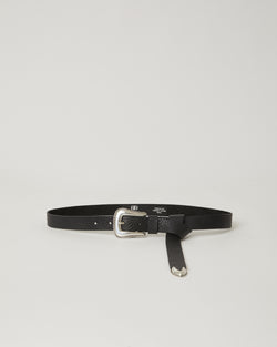 black belt with a pebbled leather strap and a silver western-style buckle and matching end tip accent.