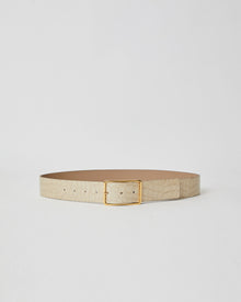 Light sand colored patent leather belt with croc-embossed finish. Fastens with simple gold triangle shaped buckle.
